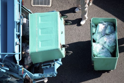 Workers sorting recyclable materials at a commercial waste site
